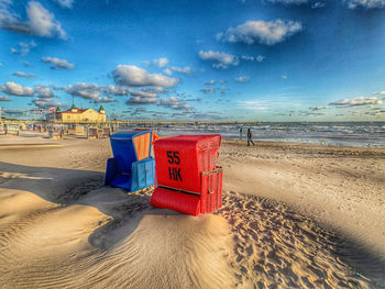 Lifeguard hut on beach against sky