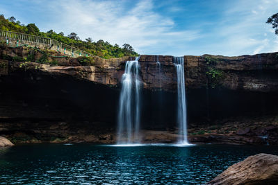 Waterfall streams falling from mountain top at morning long exposure shot from different angle