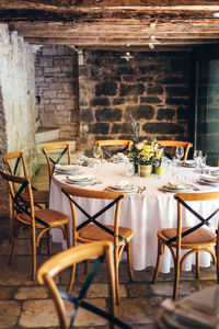 Empty chairs and tables in restaurant