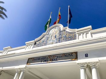 Low angle view of building against blue sky