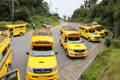 High angle view of yellow cars on street