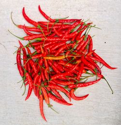 High angle view of red chili peppers on table