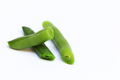 Close-up of green pepper against white background