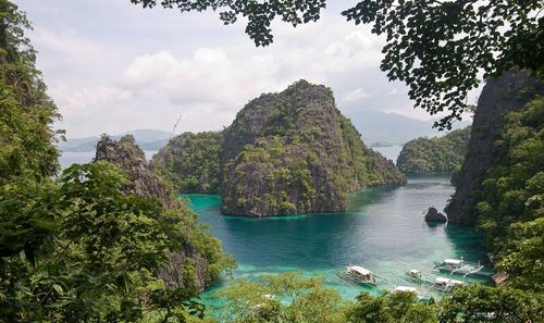 Scenic view of mountains and sea against sky