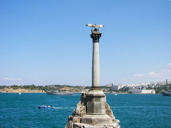 Scenic view of sea against blue sky