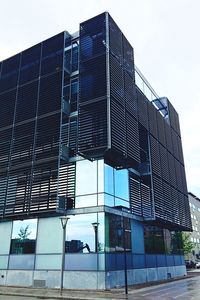 Low angle view of modern building against sky