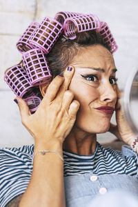 Cropped image of woman using phone