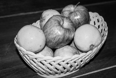 High angle view of fruits in basket on table