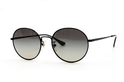 Close-up of sunglasses against white background