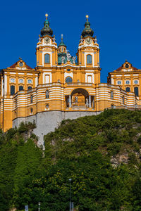 Low angle view of building against blue sky