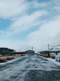 Snow covered road against sky