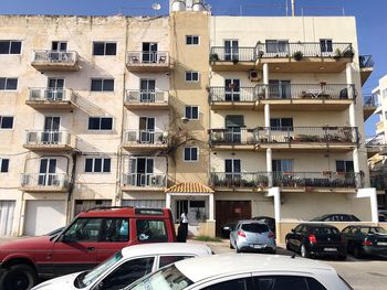 Cars parked by residential building