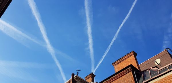 Low angle view of building against blue sky