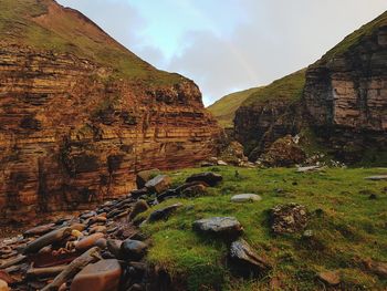 Scenic view of rock formations against sky