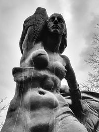 Low angle view of statue against sky