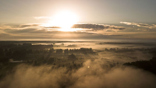 Scenic view of landscape against sky during sunset