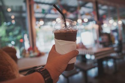 Close-up of hand holding drink