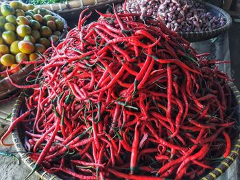 High angle view of red chili peppers at market stall
