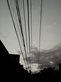 Low angle view of built structure against sky at sunset