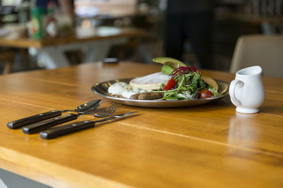 High angle view of food in plate on wooden table