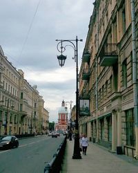 City street against cloudy sky