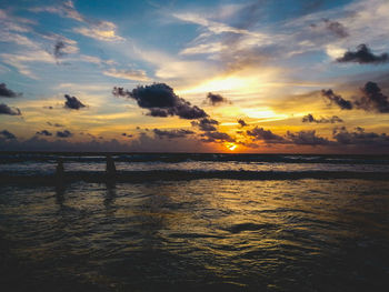 Scenic view of sea against sky at sunset