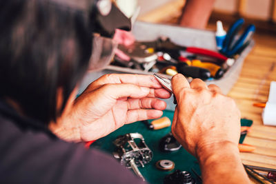 High angle view of people working on table