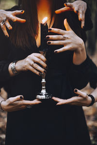 Midsection of woman playing guitar