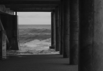 Scenic view of sea against sky seen through archway