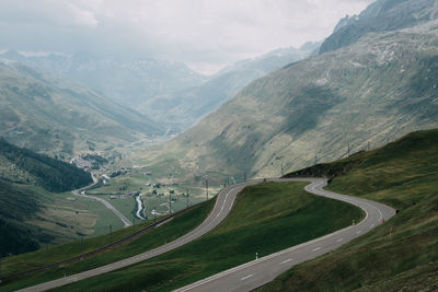 Scenic view of mountains and road against sky