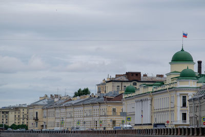 Buildings in city against sky