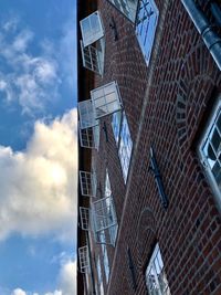 Low angle view of modern buildings against sky