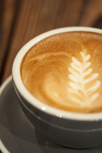 Close-up of cappuccino on table