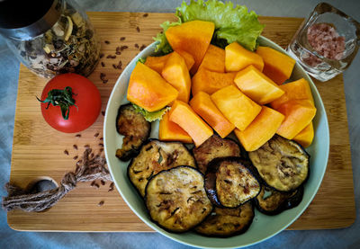 High angle view of fruits in plate on table