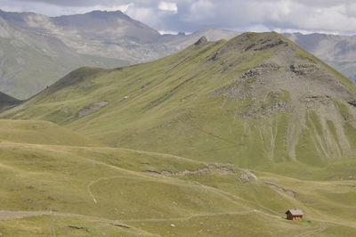 Scenic view of landscape and mountains against sky