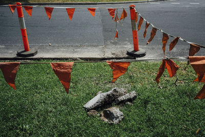 Bunting hanging from bollard on street