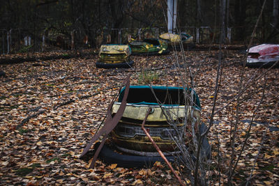 Abandoned car on field