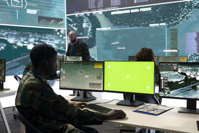 Rear view of man working in office