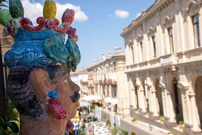 Side view of young woman in city