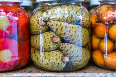 Close-up of fruits in jar on table