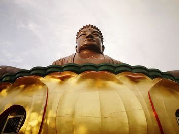 Low angle view of statue against building