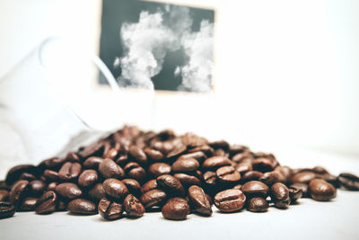 Close-up of coffee beans on table