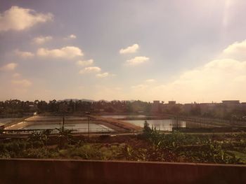 View of railroad tracks against cloudy sky