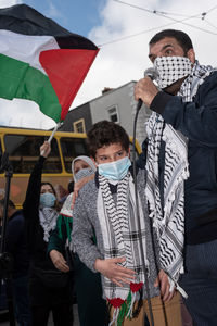 People standing with umbrella in winter