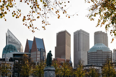 Low angle view of skyscrapers against clear sky