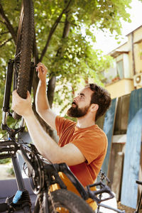 Side view of man with bicycle