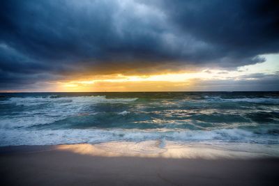 Scenic view of sea against sky during sunset