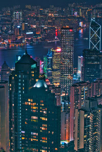 High angle view of illuminated city buildings at night