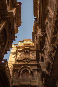 Low angle view of buildings in city against sky