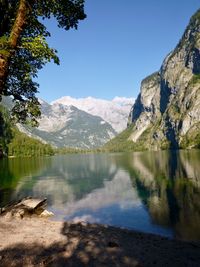 Scenic view of lake and mountains against sky